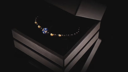 Evil eye with golden beads and onyx bracelet